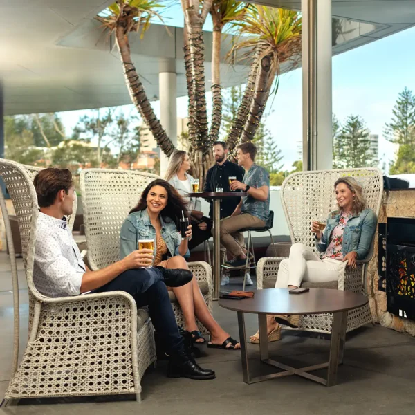 photo of a group of people enjoying a drink on the terrace